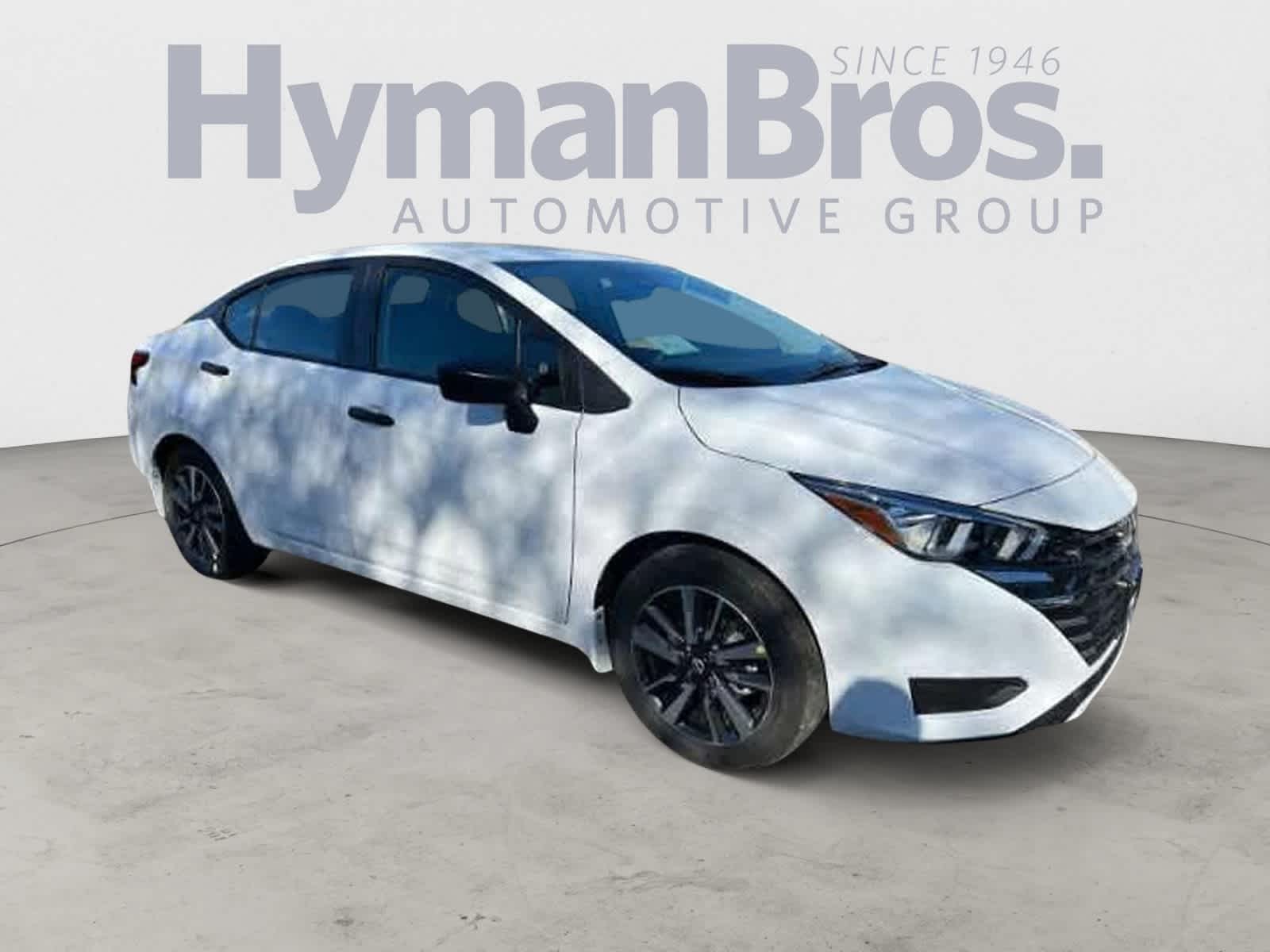 2024 Nissan Versa S in Cloud White — front three-quarter view