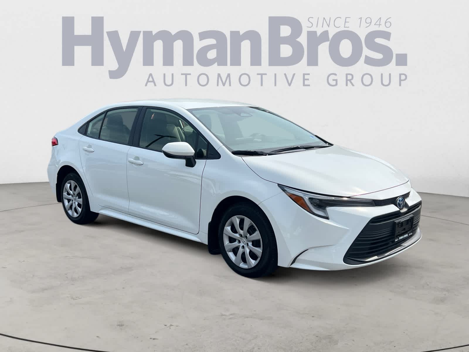 2023 Toyota Corolla Hybrid LE FWD (Natl) in Ice Cap — front three-quarter view