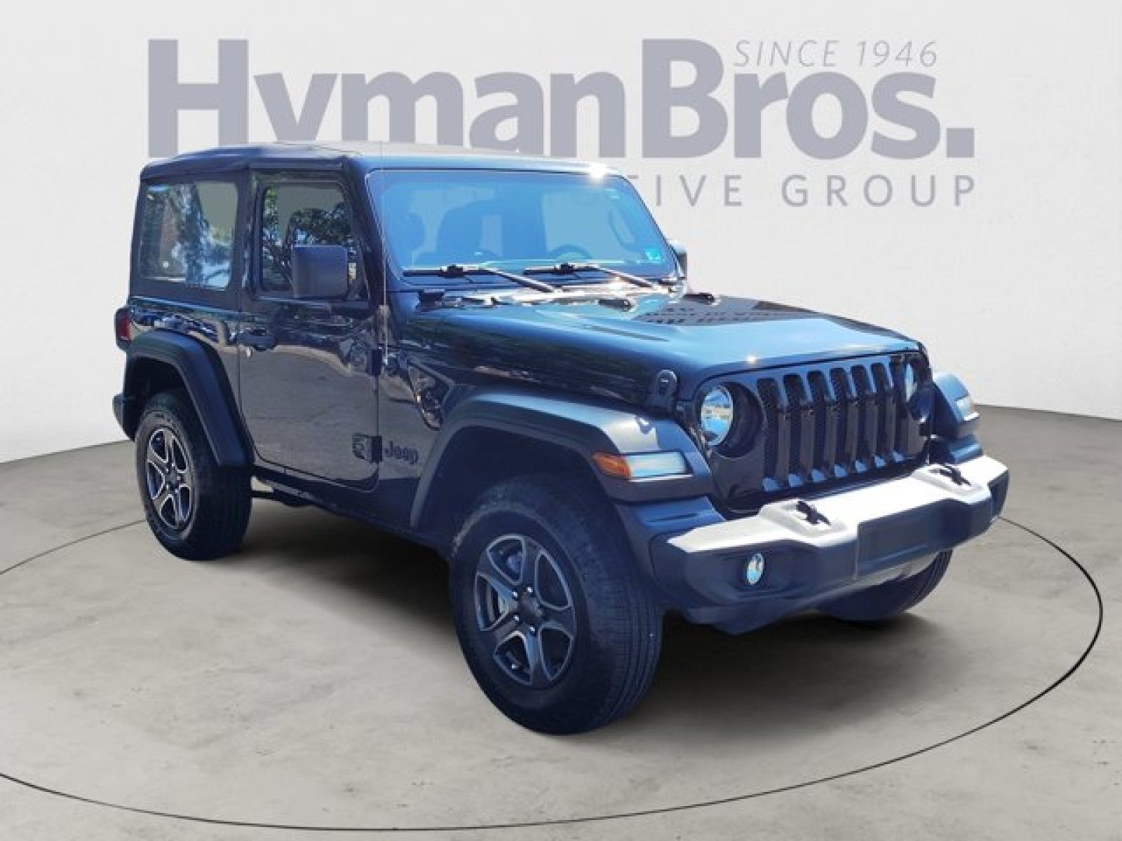 2021 Jeep Wrangler Sport 4x4 in Black Clearcoat — front three-quarter view