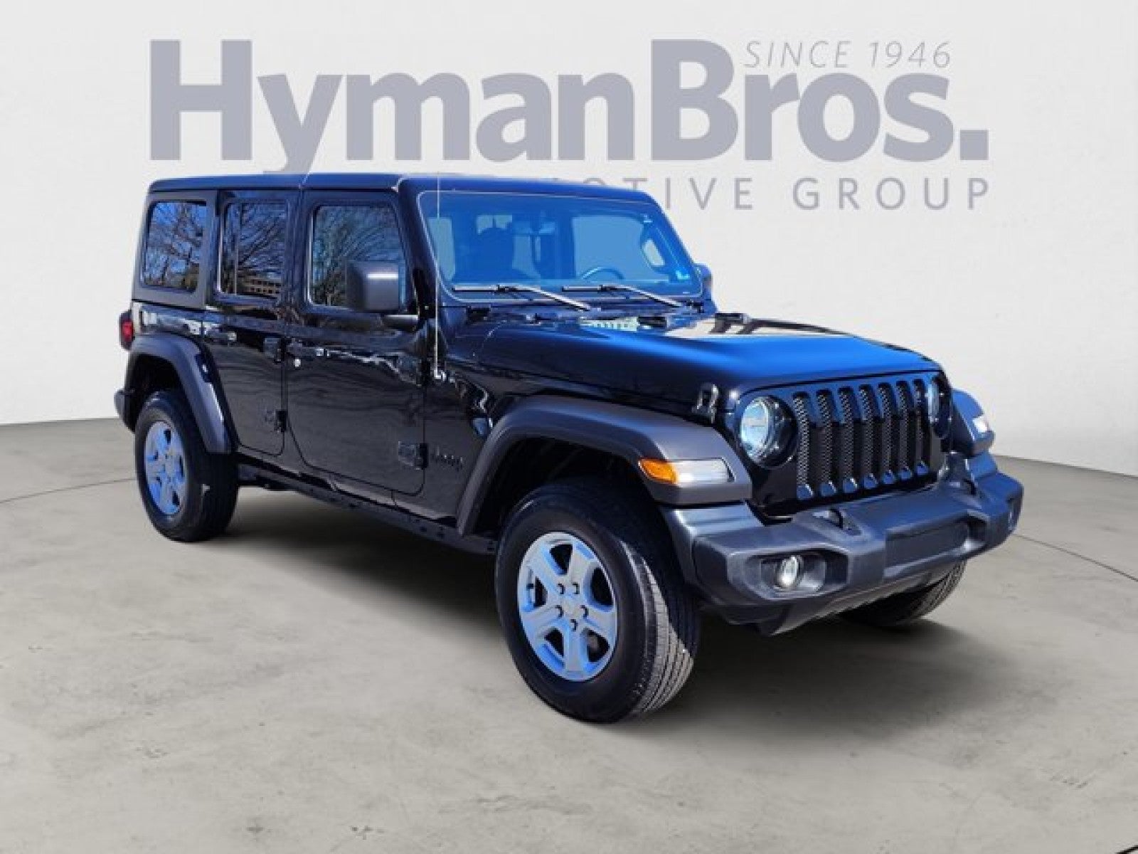 2022 Jeep Wrangler Unlimited Sport S 4x4 | Tech, Hardtop, Manual in Black Clearcoat — front three-quarter view