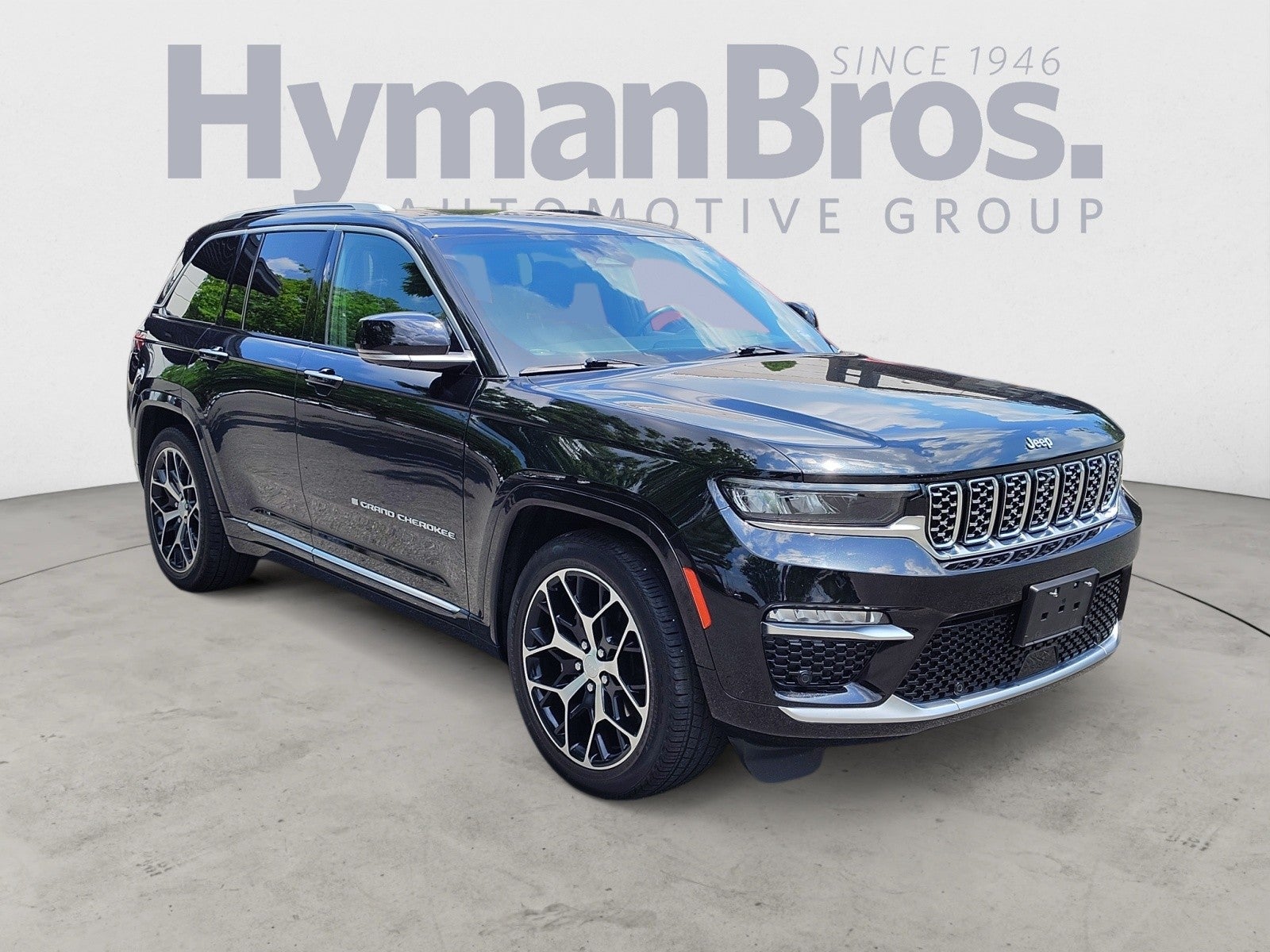2023 Jeep Grand Cherokee Summit Reserve 4x4 | $72k MSRP in Diamond Black Crystal Pearlcoat — front three-quarter view