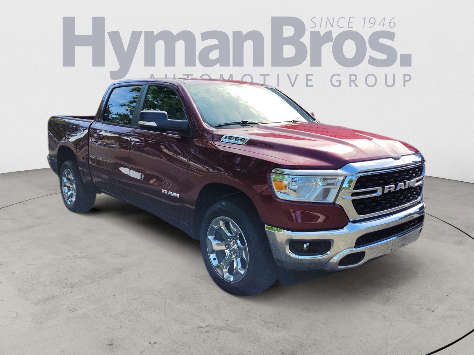 2022 RAM 1500 Big Horn 4x4 Crew Cab in Delmonico Red Pearlcoat — front three-quarter view