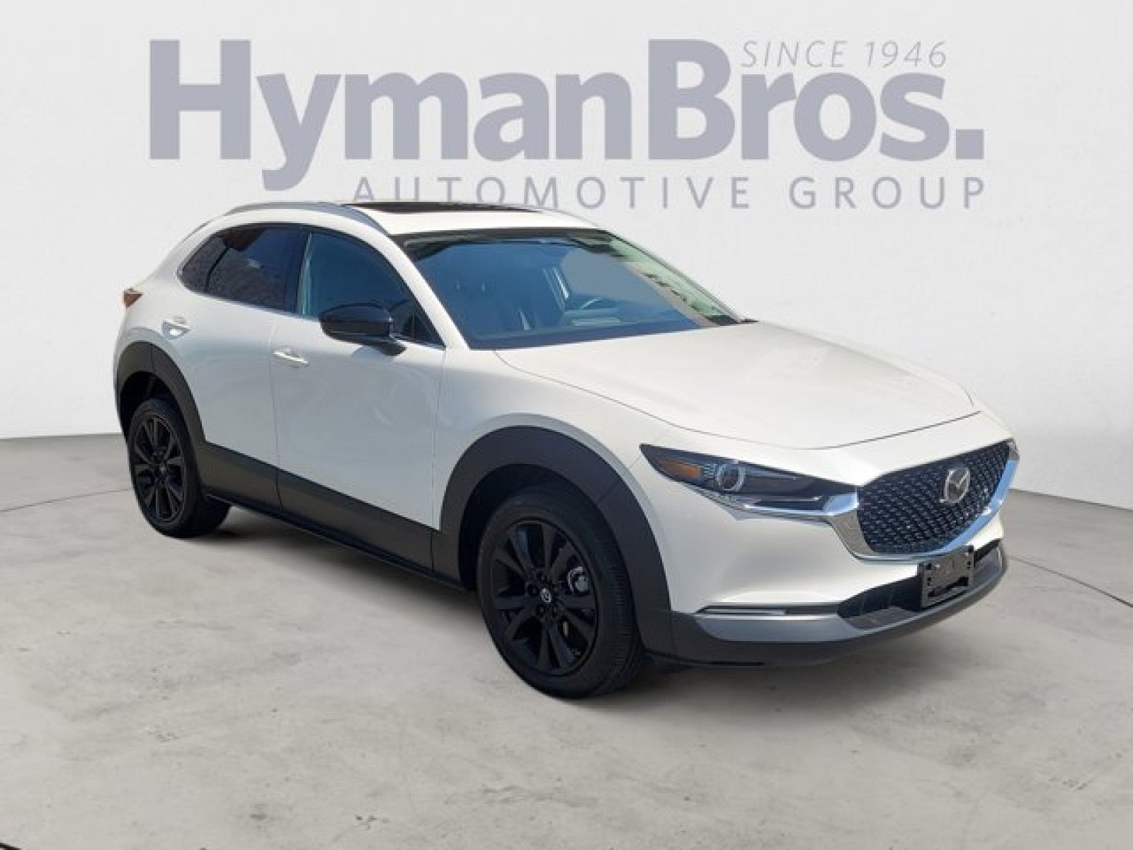 2022 Mazda Mazda CX-30 2.5 Turbo Premium Package AWD in Snowflake White Pearl Mica — front three-quarter view