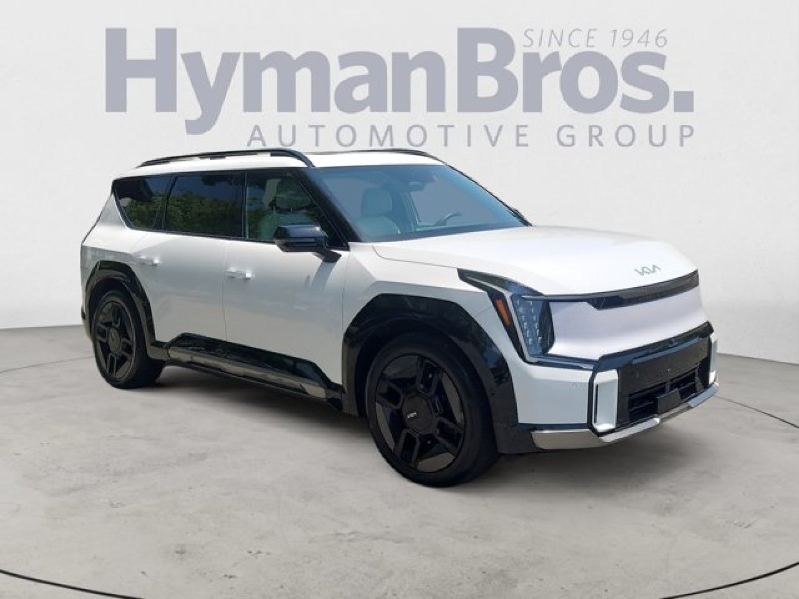 2025 Kia EV9 GT-Line AWD | VIP Seating in Glacial White Pearl — front three-quarter view
