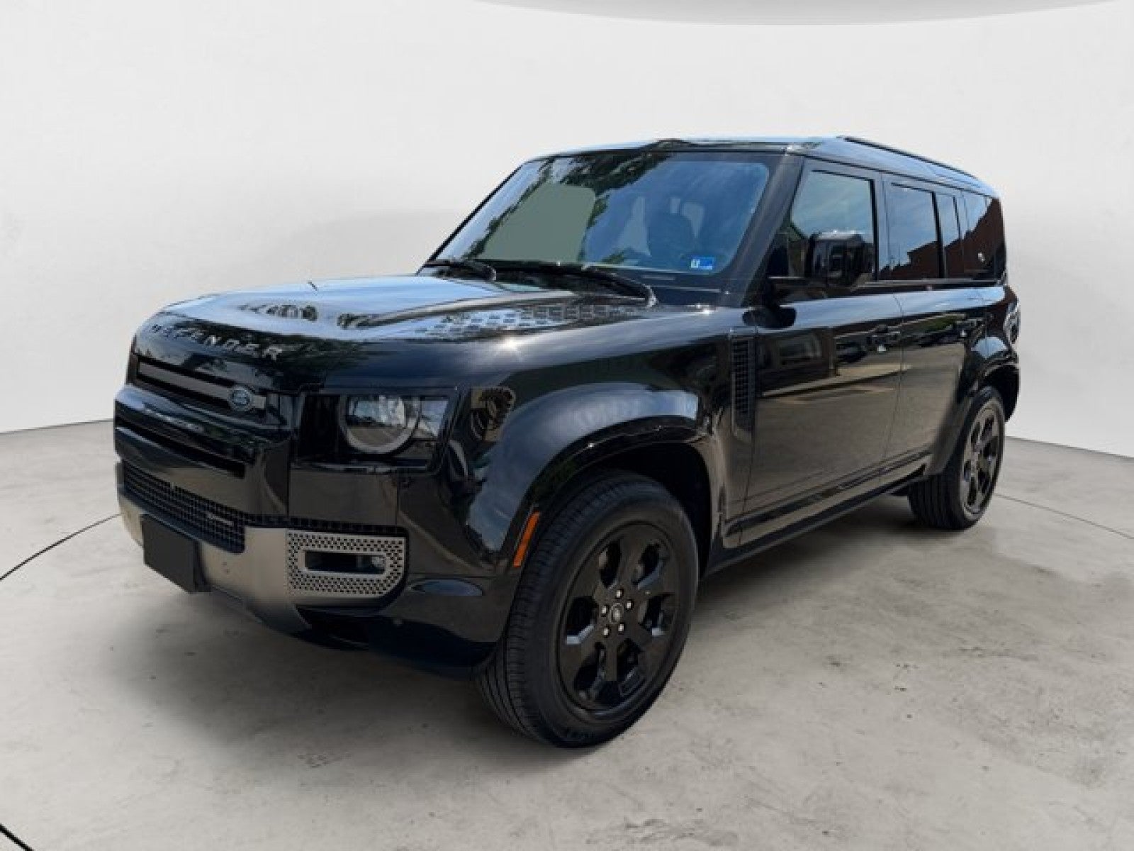 2022 Land Rover Defender X-Dynamic SE in Santorini Black Metallic — front three-quarter view